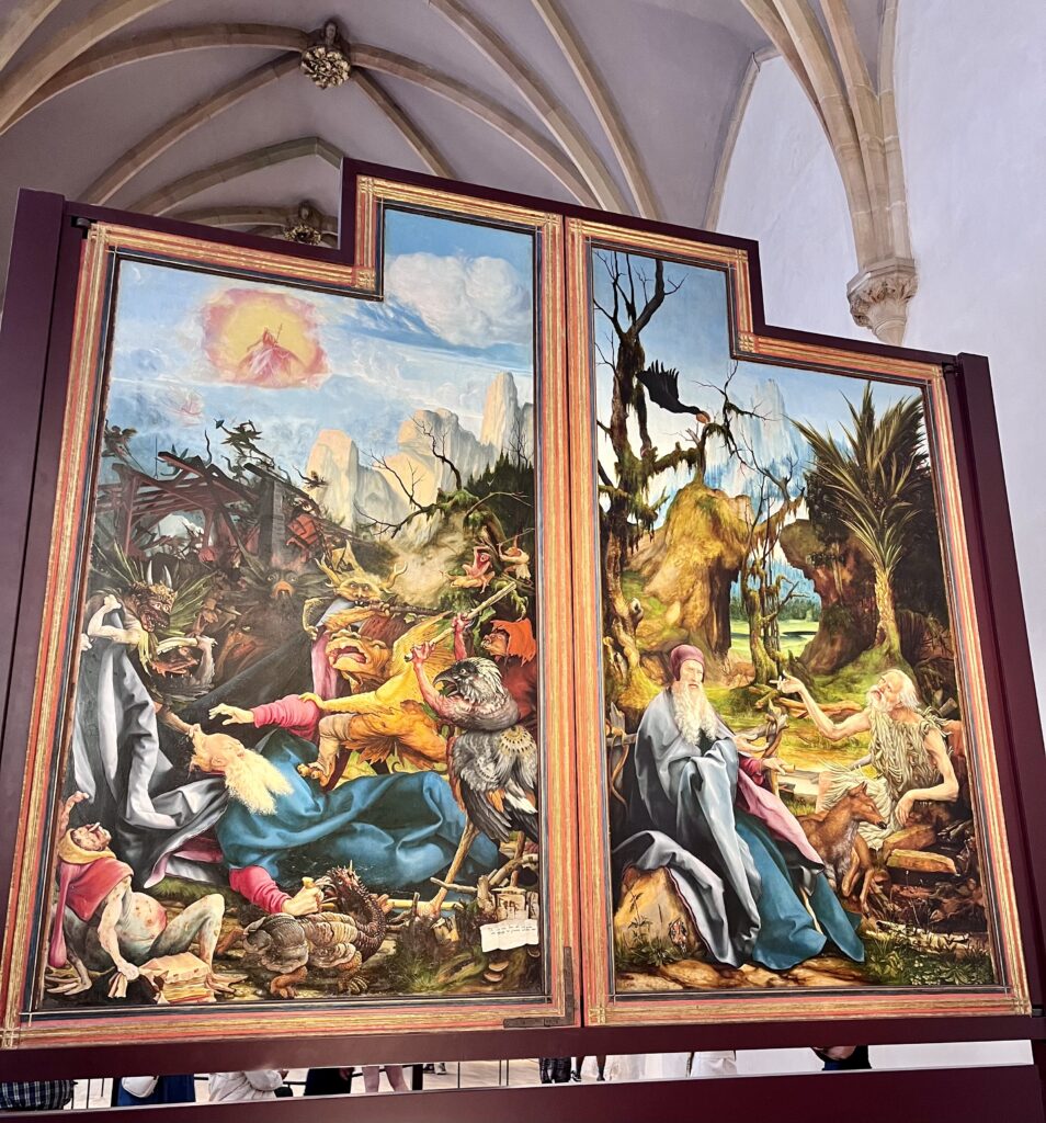 The Temptations of Saint Anthony (left panel) and Saint Anthony visits Saint Paul (right panel), Matthias Grünewald, Isenheim Altarpiece, c. 1512-16. (Unterlinden Museum, Colmar, France). Photo by Amanda Jacobs-Bissonette, September 2024
